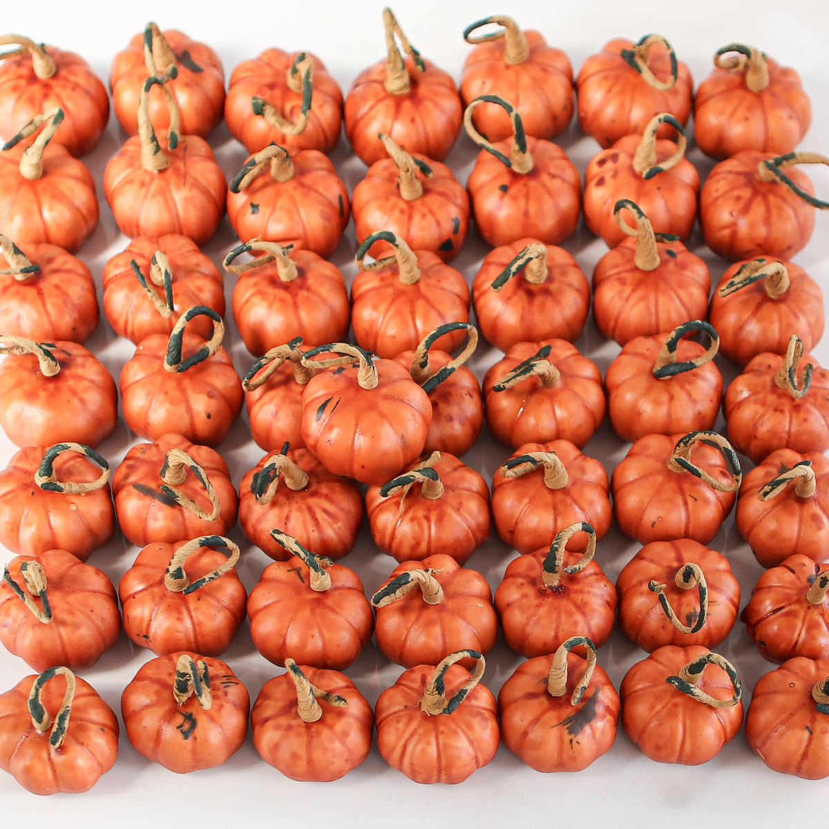 Mini Pumpkin Filler - 50 pieces, colorful petite faux pumpkins adding texture and warmth to your fall decorations.
